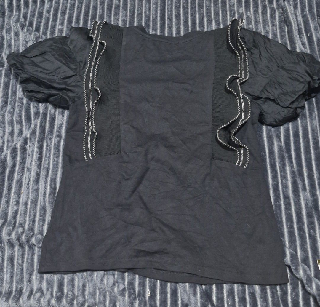 Chanel Black Top with Ruffle Detail (Category: Shirts) located in Pili. Submitted by the_g_thrift (Listing ID 1433156887, Image 2). Description: chanell size large on tag dimes: 17.5 x 24 excellent condition not fade sa camera lang .