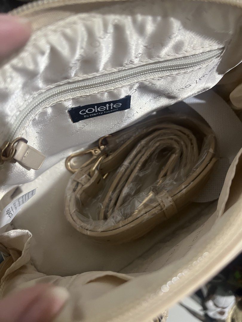 Colette by Colette Hayman Handbag (Category: Luxury Bags & Wallets) located in Quezon City. Submitted by nmxni (Listing ID 1433002116, Image 3). Description: - Cream-colored handbag from Colette by Colette Hayman - Top zipper closure - Dual handles - Detachable shoulder strap - Includes brand tag.