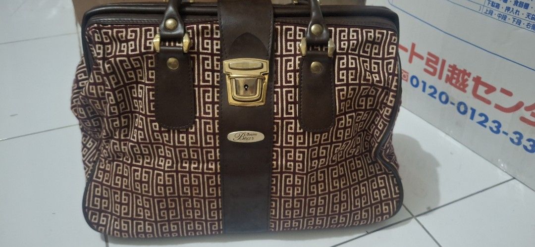 Cosmo Bear Pierre Balmain Handbag Japan (Category: Luxury Bags & Wallets) located in Manila. Submitted by youngcloud_b1fffa (Listing ID 1433190105, Image 3). Description: - Vintage Cosmo Bear handbag - Geometric pattern exterior - Gold-tone metallic frame - Signature lock closure - Light-colored interior lining - Interior pocket - Top handle - Brown strap with brand name "R&B Mix Japan Surplus Items".