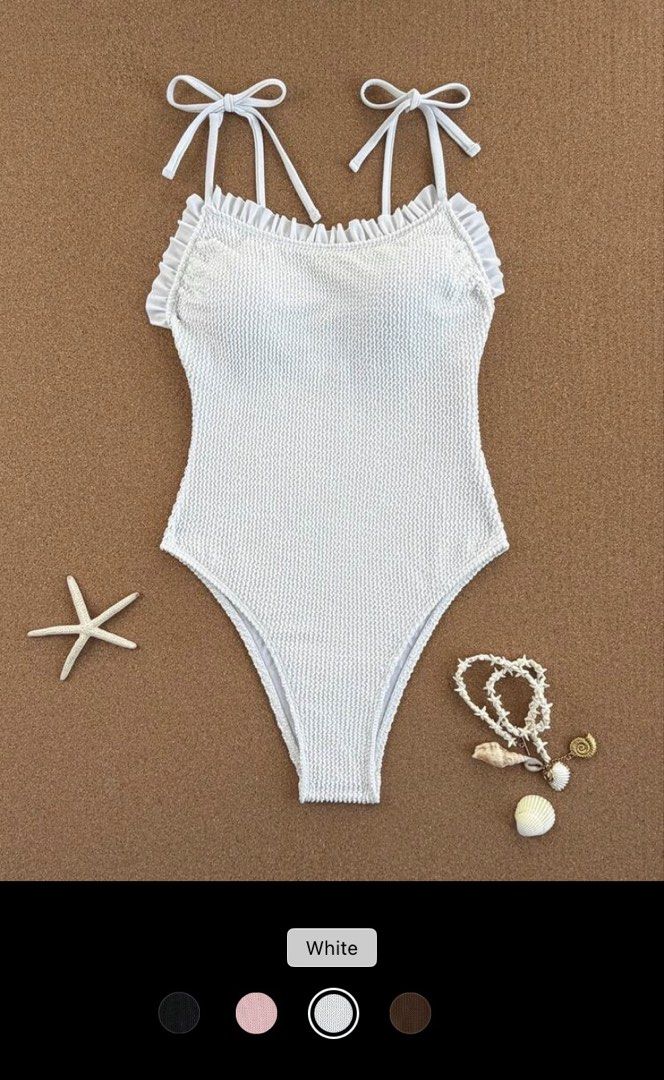 Crinkle Fabric Swimsuit One piece (Category: Bikinis & Swimsuits) located in Manila. Submitted by yeoboshop (Listing ID 1433118750, Image 2). Description: - Elegant white one-piece swimsuit. - Features spaghetti straps and ruffle details. - Made with textured crinkle fabric. - Adjustable tie straps. - Ideal for beach days and pool parties. -Small on tag.