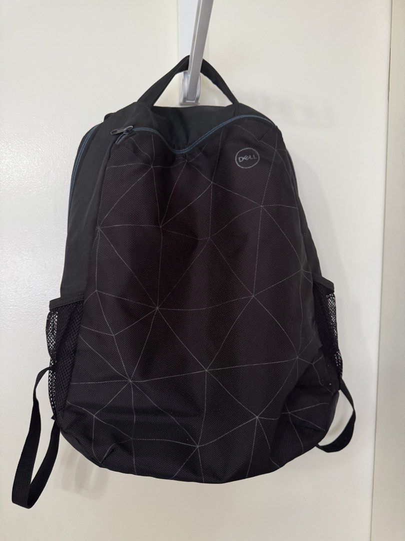 Dell Backpack (Category: Backpacks) located in Pasig City. Submitted by regden (Listing ID 1433039946, Image 1). Description: - Black Dell backpack with laptop slot - Geometric pattern - Top handle and adjustable shoulder straps - Side mesh pockets - Zippered main compartment and front pocket - Breathable mesh back panel - Ideal for everyday use.