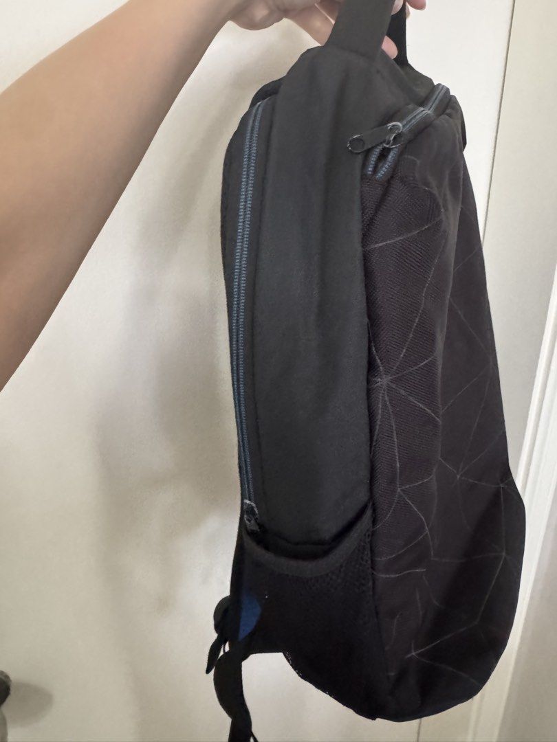 Dell Backpack (Category: Backpacks) located in Pasig City. Submitted by regden (Listing ID 1433039946, Image 3). Description: - Black Dell backpack with laptop slot - Geometric pattern - Top handle and adjustable shoulder straps - Side mesh pockets - Zippered main compartment and front pocket - Breathable mesh back panel - Ideal for everyday use.