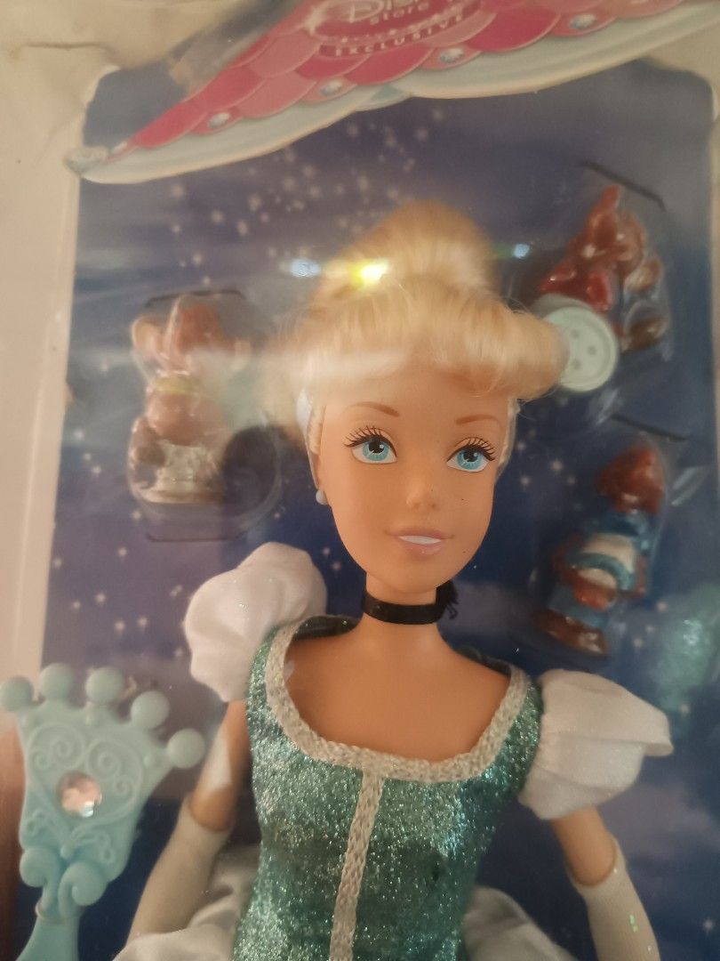 Disney Cinderella Doll (Category: Figurines & Statues) located in Naga. Submitted by cosmicrabbit.09254a (Listing ID 1433014680, Image 2). Description: - I can give a discount pag pay agad - Disney Cinderella doll - Brand new, in original packaging - Features a beautiful blue dress and blonde hair - the box has some dents, but the doll was never removed from the box - Includes accessories - Packaging showcases other Disney princesses - Back of pa