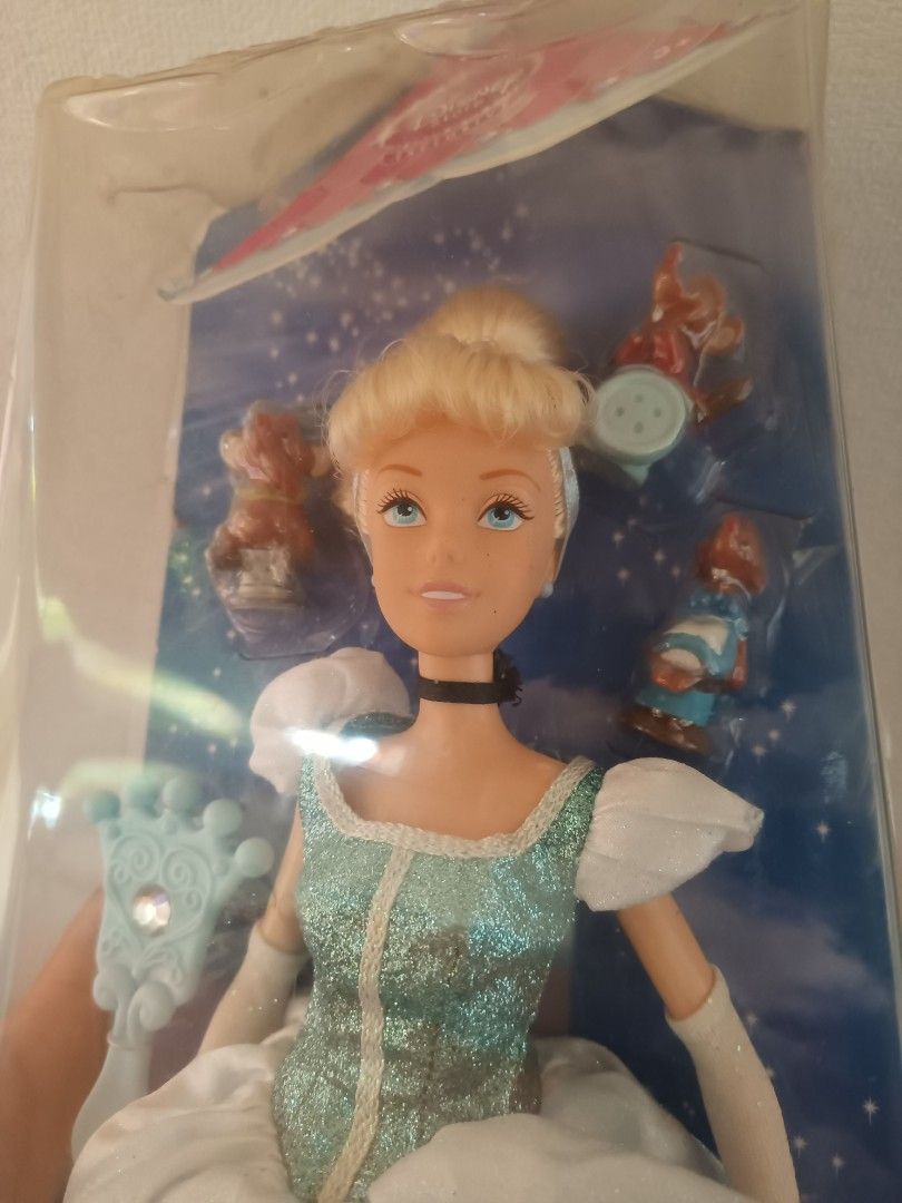 Disney Cinderella Doll (Category: Figurines & Statues) located in Naga. Submitted by cosmicrabbit.09254a (Listing ID 1433014680, Image 1). Description: - I can give a discount pag pay agad - Disney Cinderella doll - Brand new, in original packaging - Features a beautiful blue dress and blonde hair - the box has some dents, but the doll was never removed from the box - Includes accessories - Packaging showcases other Disney princesses - Back of pa