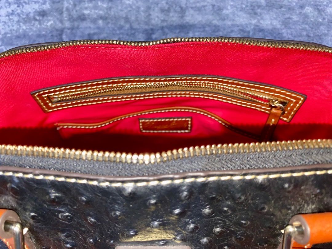 Dooney & Bourke Ostrich Zip Satchel (Category: Luxury Bags & Wallets) located in Manila. Submitted by mcqueenskicks (Listing ID 1433081560, Image 3). Description: Details: • Embossed premium calf leather. • Zipper closure. • Adjustable, detachable shoulder strap. • Strap drop length: 21". • Handle drop length: 5". • H 9.25" x D 5.25" x L 11.5" • Designed in Norwalk, CT by Peter Dooney. • Outside zip pocket. One inside zip pocket. Two inside pocke