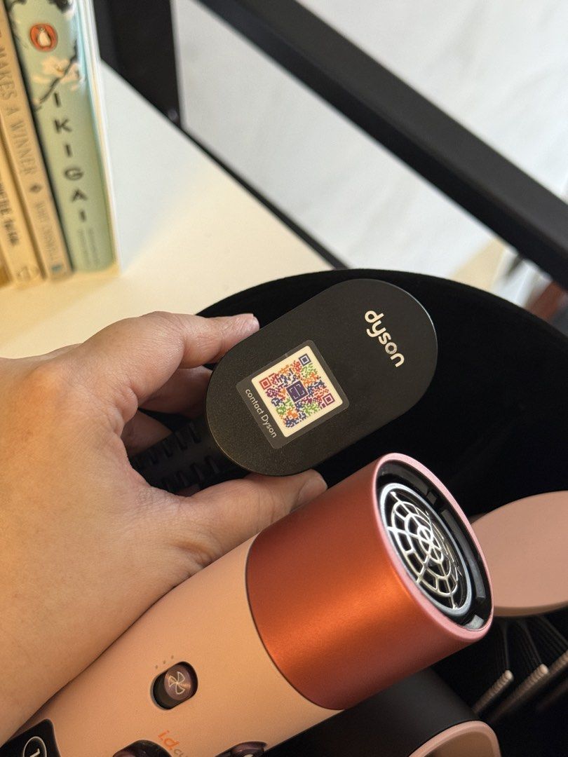 Dyson Airwrap ID (Category: Hair) located in Quezon City. Submitted by maria___x (Listing ID 1433202667, Image 2). Description: - Dyson Airwrap ID Complete Styler for curling, waving, smoothing, and drying. - Includes multiple styling attachments. - Comes with a storage case. - Color: SAKURA CHERRY.