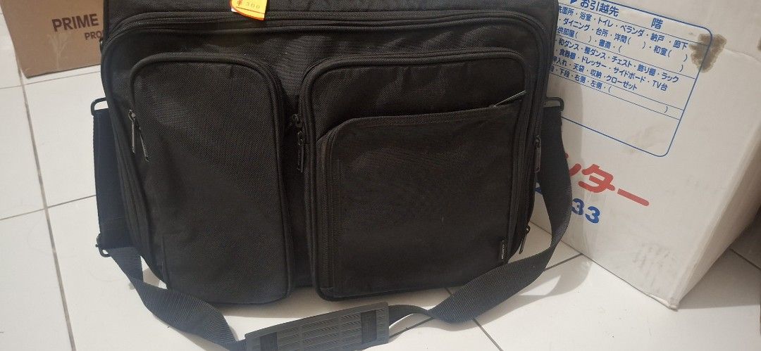 Elecom Laptop Bag Shock Proof Japan (Category: Laptop Bags & Sleeves) located in Manila. Submitted by youngcloud_b1fffa (Listing ID 1433190862, Image 1). Description: - Black Elecom laptop bag - Durable construction - Multiple compartments for organization - Includes shoulder strap and handle - Exterior and interior pockets for storage - Branded Elecom zippers "R&B Mix Japan Surplus Items".