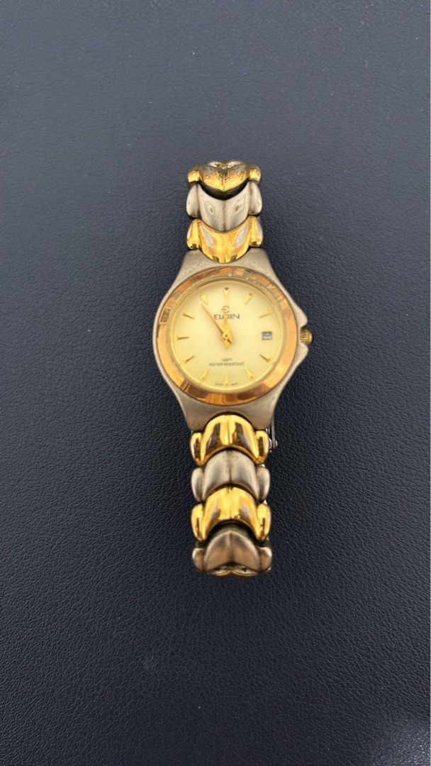 ELGIN ladies watch (Category: Women's Watches) located in Pasig City. Submitted by bmdboutique (Listing ID 1433208038, Image 2). Description: - Two-tone design (faded hardware) - Water-resistant - Date display - Classic style - heavy on wrist - very nice lock.