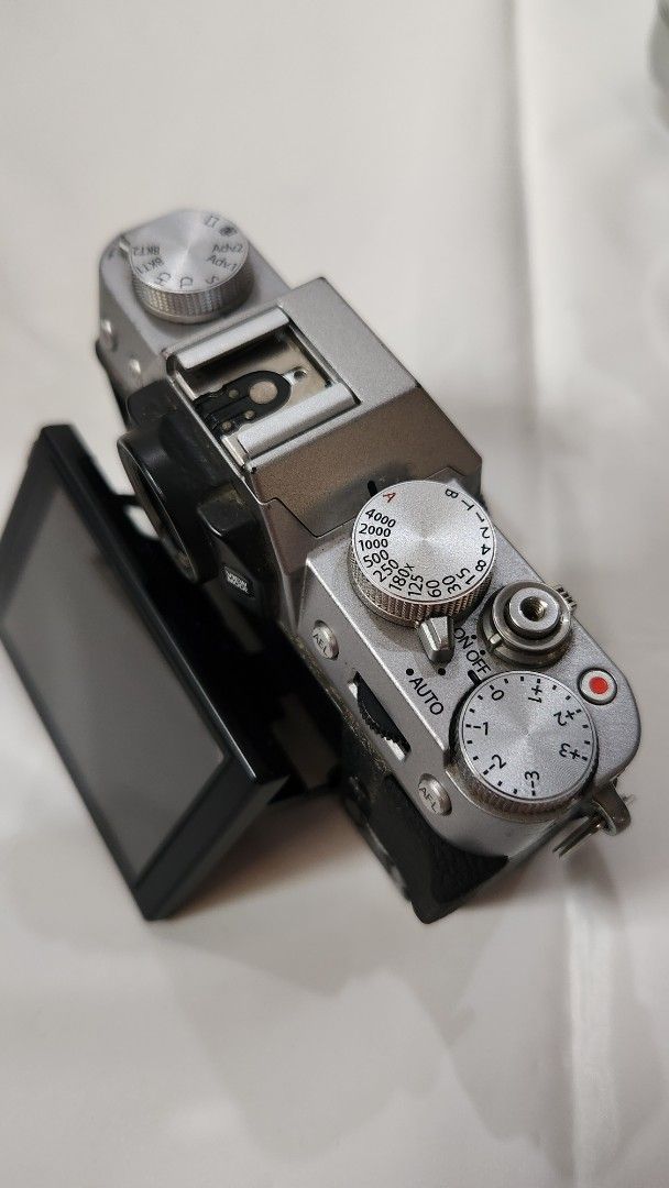Fujifilm X-T10 Camera with Lenses (Category: Cameras) located in Antipolo. Submitted by luislasi (Listing ID 1433148589, Image 3). Description: - Fujifilm X-T10 camera body - Two lenses: = 16-50mm zoom lens (silver) = and 35mm prime lens (black) (thrid party) - Three batteries - Two Battery charger (one third party) - Camera strap - Hand grip (third party small rig) - Lens cap - Small tool - Original box - Features a flip-out screen and manual di