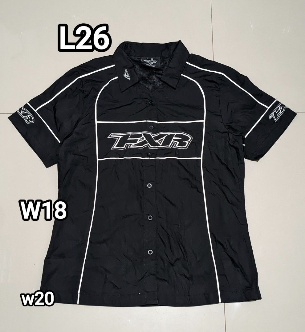 FXR Short Sleeve Shirt (Category: Blouses) located in Caloocan City. Submitted by wupeeram (Listing ID 1433135639, Image 1). Description: - Black short sleeve shirt - White FXR logo and accents - Collared neckline - Button-up front - FXR logo on front, back, and sleeves - Size: L26, W18, W20 - Brand new condition - Made in China.