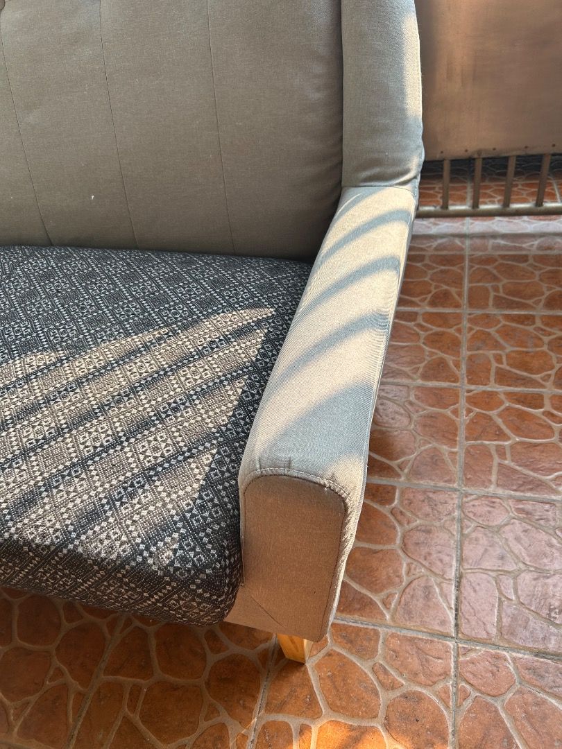 Gray Fabric Loveseat (Category: Sofas) located in Pasig City. Submitted by mina_mahal (Listing ID 1433000818, Image 3). Description: - Stylish loveseat - Gray fabric back and sides - Patterned seat cushion - Wooden legs - Button-tufted backrest and armrests - Comfortable seating option.