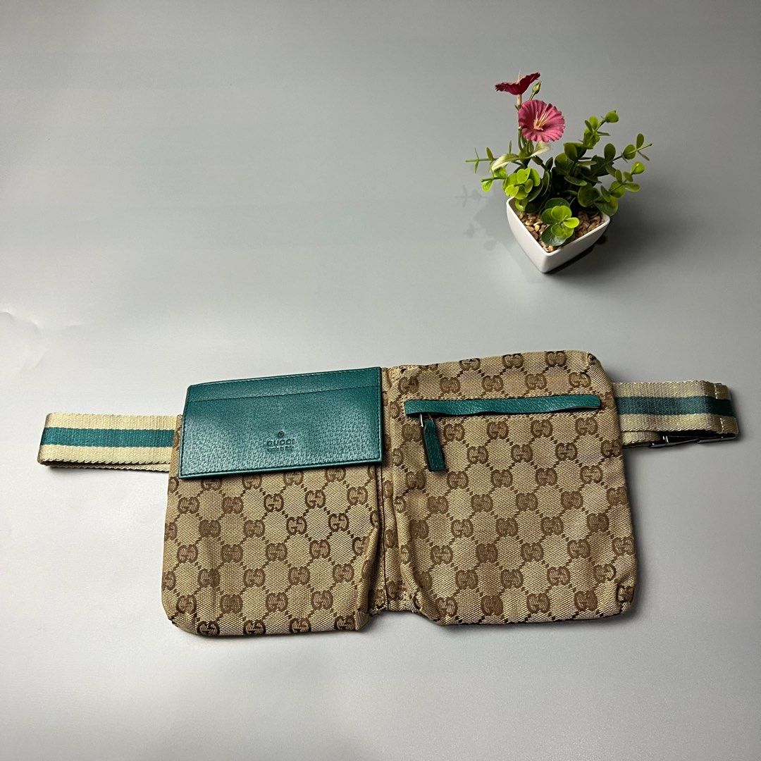 Gucci GG Canvas Waist Bag (Category: Luxury Bags & Wallets) located in Bago City. Submitted by g___shop (Listing ID 1433127288, Image 2). Description: - Authentic Gucci waist bag - Iconic GG canvas - Teal leather card holder and accents - Main compartment and front pocket - Adjustable strap with silver buckle - Made in Italy - Rank A.