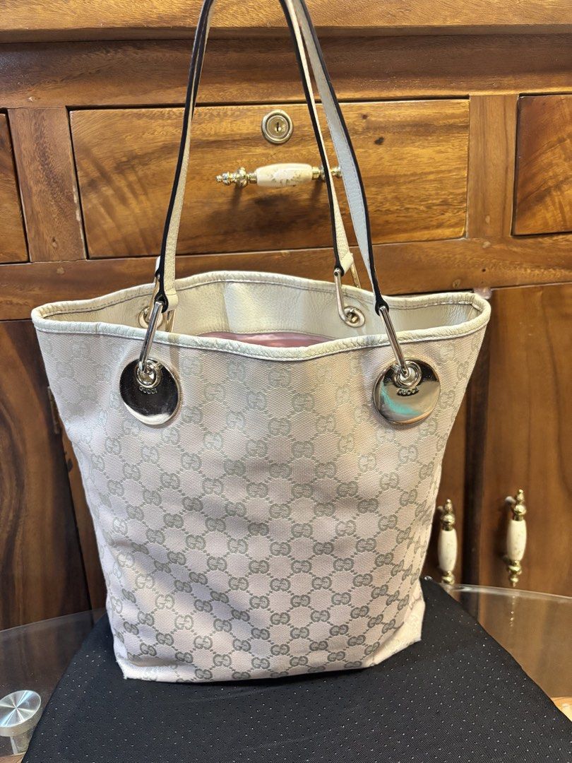 Gucci pink canvass tote (Category: Luxury Bags & Wallets) located in Imus. Submitted by bagsofblessings24 (Listing ID 1433154173, Image 1). Description: Gucci pink canvas tote Medium size, coded Very good condition Verbally authenticated by Japan buyer of preloved Intact straps and rubber lining Minor tolerable flaws - hairlines on the hardware and tiny rubs at the bottom corner, dirt in the interior Height 12 x length 9.5 x bottom 4 in Pm for ot