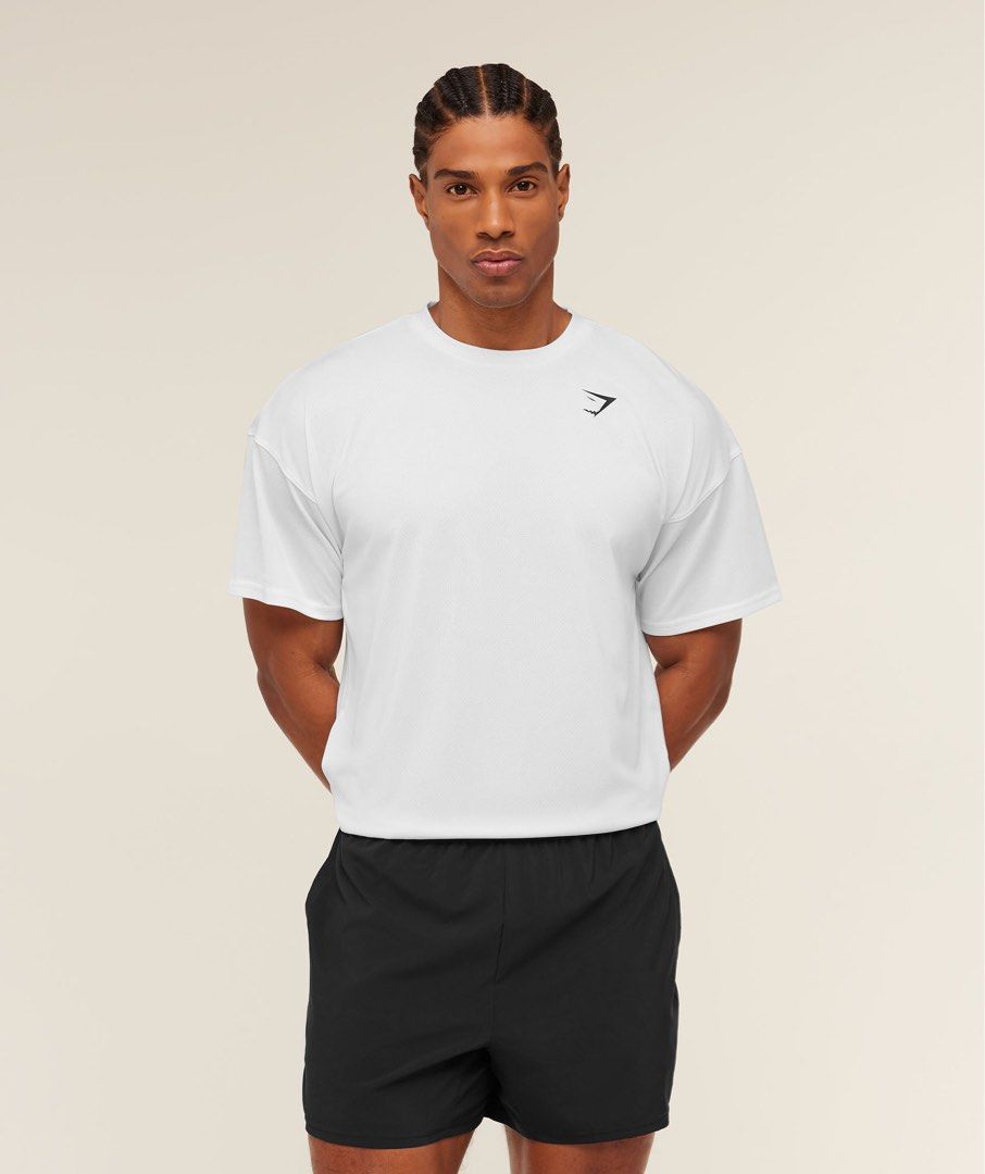 Gymshark Arrival Oversized T-shirt - White (Category: Activewear) located in Quezon City. Submitted by cptsp (Listing ID 1433091682, Image 1). Description: - Gymshark Arrival Oversized T-shirt - Color: White - Size: L - Condition: New with original packaging - Features: Oversized fit, crew neck, short sleeves - Material: Made from recycled materials.