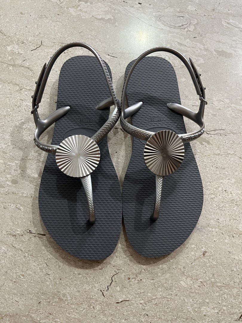 Havaianas Twist Metal Sandals - Size 37/38 (Category: Sandals) located in Singapore. Submitted by portia1218 (Listing ID 1433070547, Image 1). Description: Worn once only. As good as brand new condition. - Size: 37/38 - Unique design with metallic accent - Perfect for everyday wear.