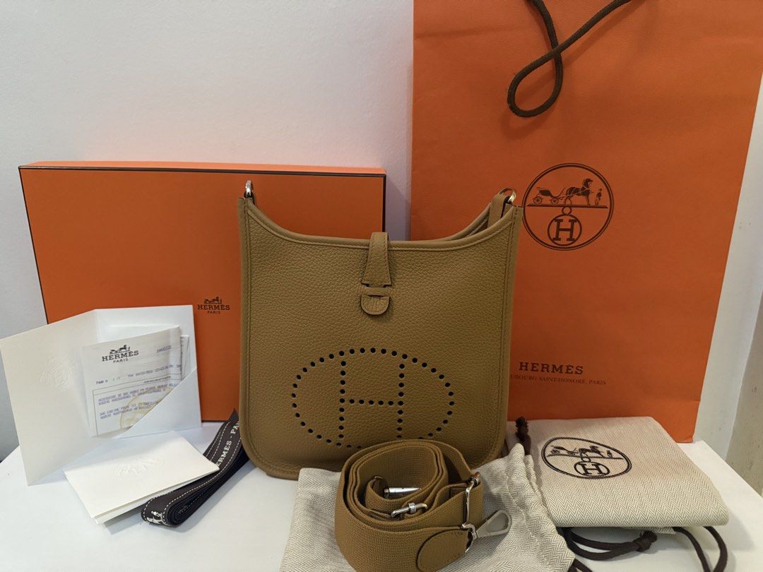 Hermes Evelyne 23 ( NEW Perfect size ) (Category: Luxury Bags & Wallets) located in Bacoor. Submitted by mademoiselle0625 (Listing ID 1433069396, Image 1). Description: - Brandnew Authentic Hermes Evelyne 23 bag - Beautiful Biscuit color - Includes original box dust bags for bag and strap, care booklet, paperbag, box, ribbon and receipt - free 2 third party straps.