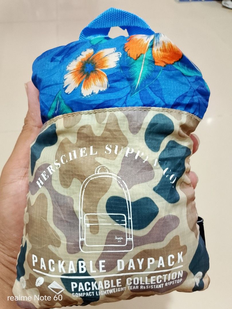 Herschel Supply Co. Packable Daypack Bag (Category: Backpacks) located in Tagum. Submitted by tgm2023 (Listing ID 1433180691, Image 2). Description: Herschel Supply Co. Packable Daypack Color : Duck Camo/Paradise Excellent condition Vol. : approx 18L to 20L Packable ✅ Lightweight ✅ Compact ✅ Ripstop fabric ✅ Water repellent ✅ 🏷️400.⁰⁰.