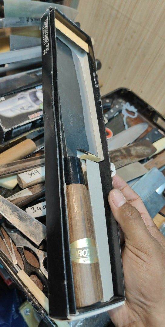 Hirotomo Japanese Kitchen Knife (Category: Knives & Chopping Boards) located in Cavite. Submitted by sevillajoh71978 (Listing ID 1433014538, Image 2). Description: - Authentic Hirotomo Japanese kitchen knife - Santoku style - Wooden handle - Blade with Japanese characters - Comes with original box - Box features Hirotomo brand name and horse logo.