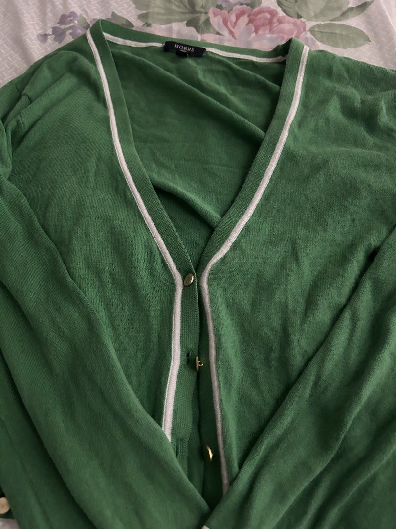 Green Cardigan (Category: Coats, Jackets and Outerwear) located in Manila. Submitted by cheatea (Listing ID 1433182126, Image 3). Description: - Hobbs London cardigan - Green color - V-neck design - White trim - Gold buttons - Visible brand tag.