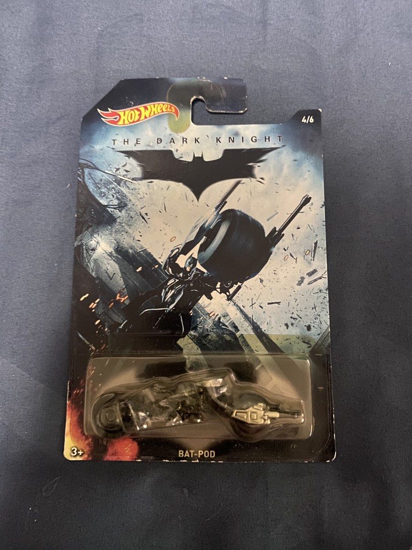 Hot Wheels The Dark Knight Bat-Pod (Category: Vehicle & Diecast Models) located in Manila. Submitted by 4us.wh0 (Listing ID 1433035235, Image 1). Description: - Hot Wheels Bat-Pod diecast car - From The Dark Knight series - Number 4 of 6 in the series - Color: Black - Comes in original packaging - Packaging features Batman logo and movie title - Suitable for ages 3+.