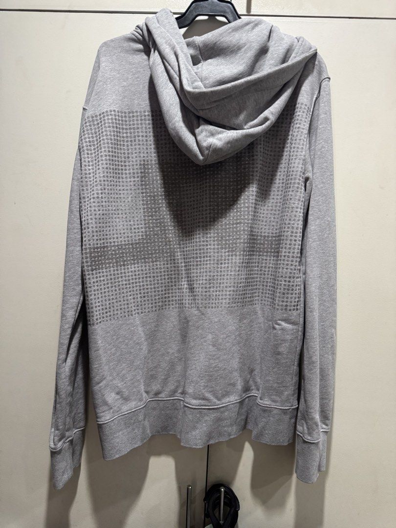J. Lindeberg Zip-Up Hoodie (Category: Coats, Jackets and Outerwear) located in Paranaque City. Submitted by warmeagle_be0856 (Listing ID 1433056957, Image 3). Description: - J. Lindeberg gray zip-up hoodie - Size: Large - Features: - Hood - Front pockets - Full-length zipper - Subtle pattern on the back - Made in Portugal.