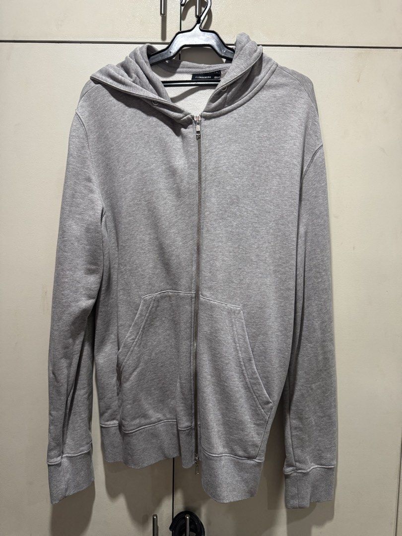J. Lindeberg Zip-Up Hoodie (Category: Coats, Jackets and Outerwear) located in Paranaque City. Submitted by warmeagle_be0856 (Listing ID 1433056957, Image 1). Description: - J. Lindeberg gray zip-up hoodie - Size: Large - Features: - Hood - Front pockets - Full-length zipper - Subtle pattern on the back - Made in Portugal.