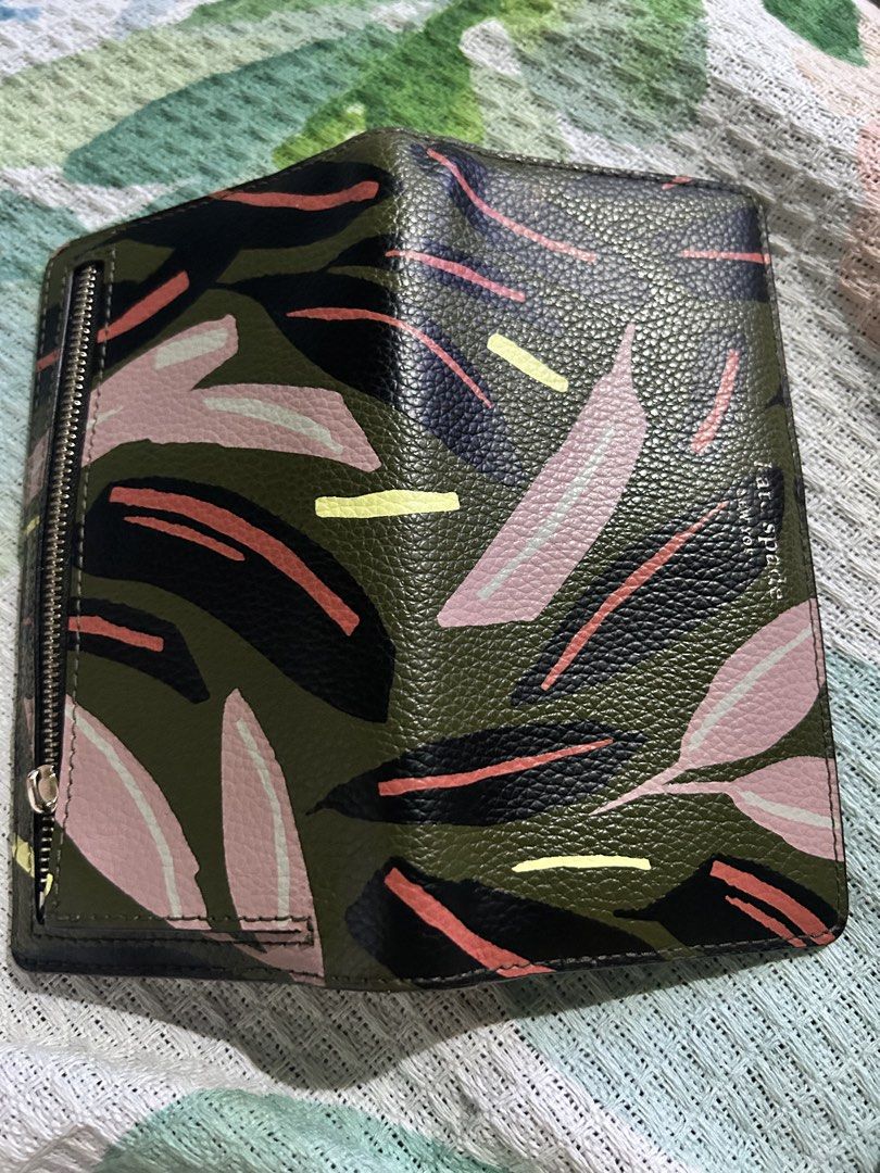 Kate Spade Floral Wallet (Category: Wallets & Card holders) located in Rizal. Submitted by declutter101s (Listing ID 1433044318, Image 1). Description: - Kate Spade floral design wallet. - Features a zip-around closure. - Interior includes multiple card slots and a clear ID window. - Black interior with a snap closure. - Designed with a textured finish..