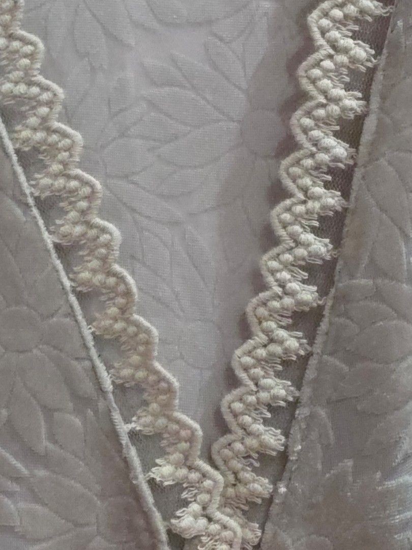 Lace Floral Korean Blouse (Category: Blouses) located in Valenzuela. Submitted by cbianx (Listing ID 1433109434, Image 3). Description: - Korean-made blouse - Delicate floral pattern - V-neckline with lace trim - Long sleeves - Button-down front - Soft, textured fabric - Light, neutral color.