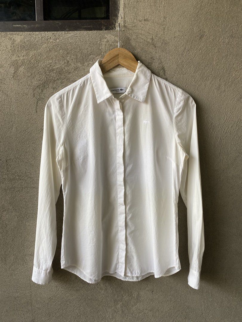 Lacoste Slim Fit White Shirt (Category: Activewear) located in Tuguegarao City. Submitted by thriftnigelo (Listing ID 1433002231, Image 1). Description: - Authentic Lacoste shirt - Slim fit - Color: White - Features Lacoste crocodile logo - Size: 36 dimes 17.5 bu 24 - Made in Romania - Material: 95% cotton, 5% elastane - Classic and versatile design.