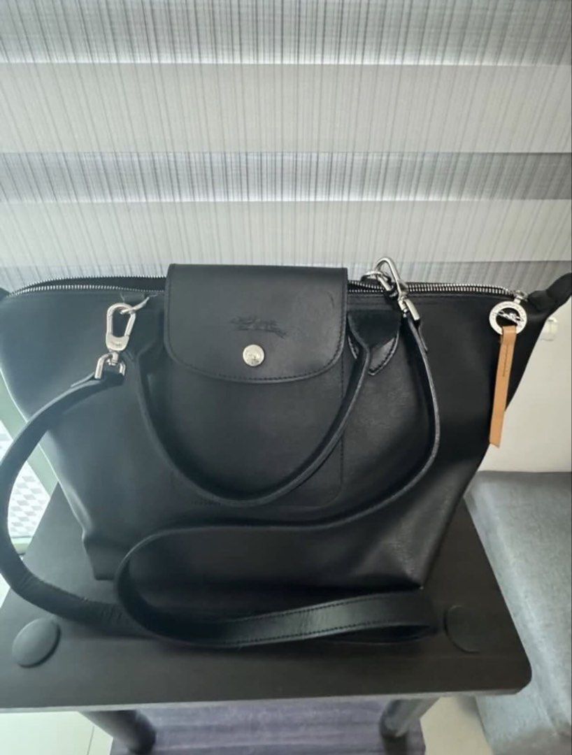 Longchamp Le Pliage City Small Shoulder Handbag (Category: Luxury Bags & Wallets) located in San Juan City. Submitted by pinkbelle14 (Listing ID 1433012507, Image 2). Description: LE PLIAGE CITY SMALL SHOULDER BAG IN BLACK Longchamp “Le Pliage City” shoulder bag in soft lightweight nylon, canvas, and leather Rolled top handles Adjustable shoulder strap Center flap top with snap and zip closures Approx. 9.8”H x 9.1”W x 6.3”D Bought in France Made 