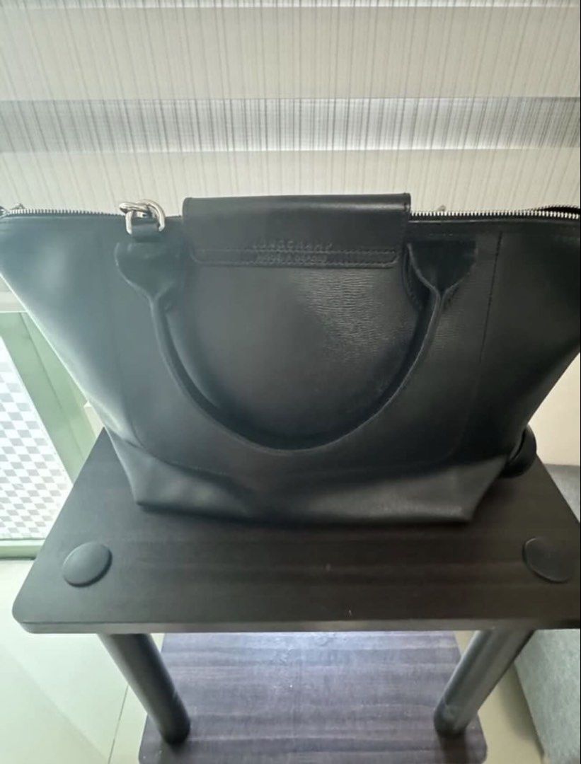 Longchamp Le Pliage City Small Shoulder Handbag (Category: Luxury Bags & Wallets) located in San Juan City. Submitted by pinkbelle14 (Listing ID 1433012507, Image 3). Description: LE PLIAGE CITY SMALL SHOULDER BAG IN BLACK Longchamp “Le Pliage City” shoulder bag in soft lightweight nylon, canvas, and leather Rolled top handles Adjustable shoulder strap Center flap top with snap and zip closures Approx. 9.8”H x 9.1”W x 6.3”D Bought in France Made 