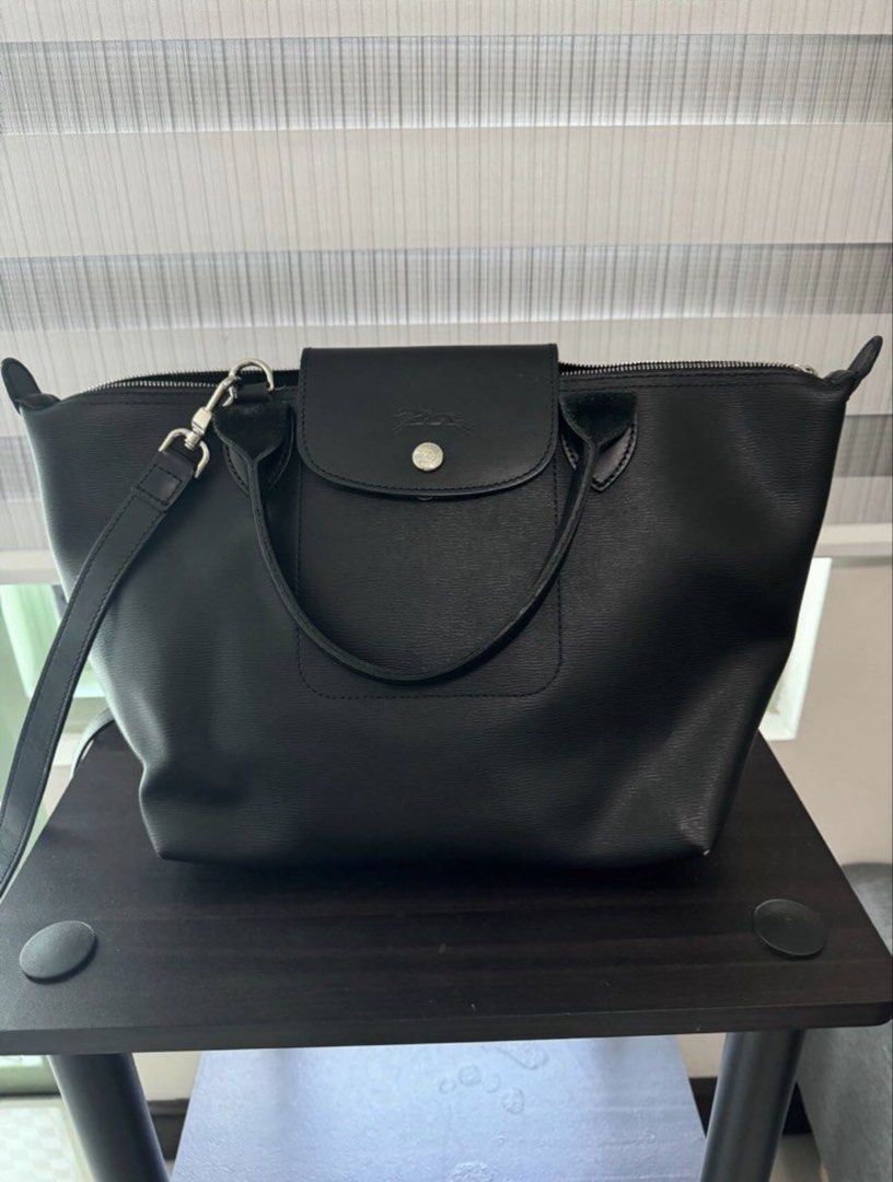 Longchamp Le Pliage City Small Shoulder Handbag (Category: Luxury Bags & Wallets) located in San Juan City. Submitted by pinkbelle14 (Listing ID 1433012507, Image 1). Description: LE PLIAGE CITY SMALL SHOULDER BAG IN BLACK Longchamp “Le Pliage City” shoulder bag in soft lightweight nylon, canvas, and leather Rolled top handles Adjustable shoulder strap Center flap top with snap and zip closures Approx. 9.8”H x 9.1”W x 6.3”D Bought in France Made 