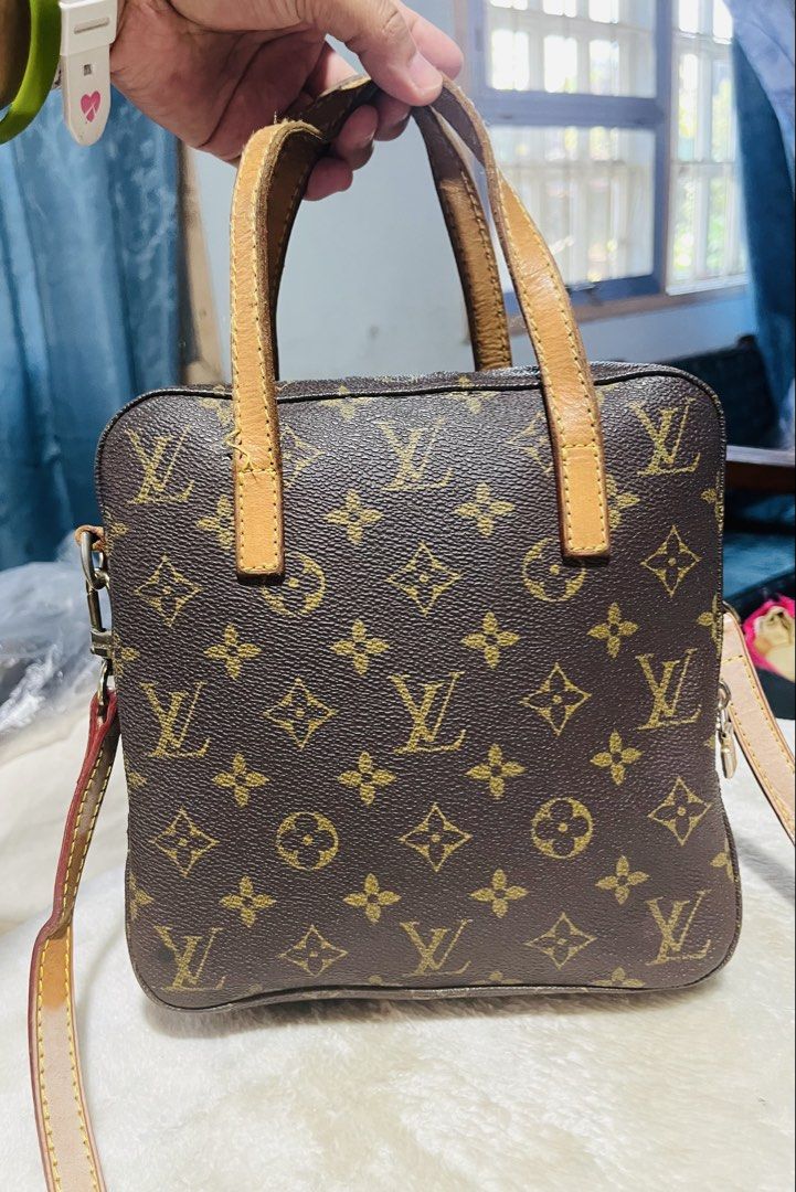 Louis Vuitton Monogram Square Handbag (Category: Ear Care) located in Mandaue City. Submitted by chuchi152615 (Listing ID 1433057697, Image 2). Description: - Authentic Louis Vuitton handbag - Classic Monogram canvas - Square shape - Top handles and detachable shoulder strap - Secure zip closure - Spacious interior - Leather trim with signs of wear - Features Louis Vuitton logo.