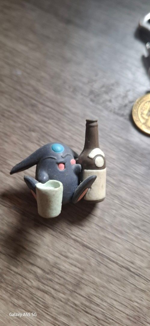 Magic Knight Rayearth Mokona Black (Category: Figurines & Statues) located in Valenzuela. Submitted by winssian (Listing ID 1433082157, Image 1). Description: - Custom-made Pokemon figurine - Unique dark blue character design - Includes bottle and scroll details - Features light blue eye and pink accents - Hand-painted - Small, collectible size.
