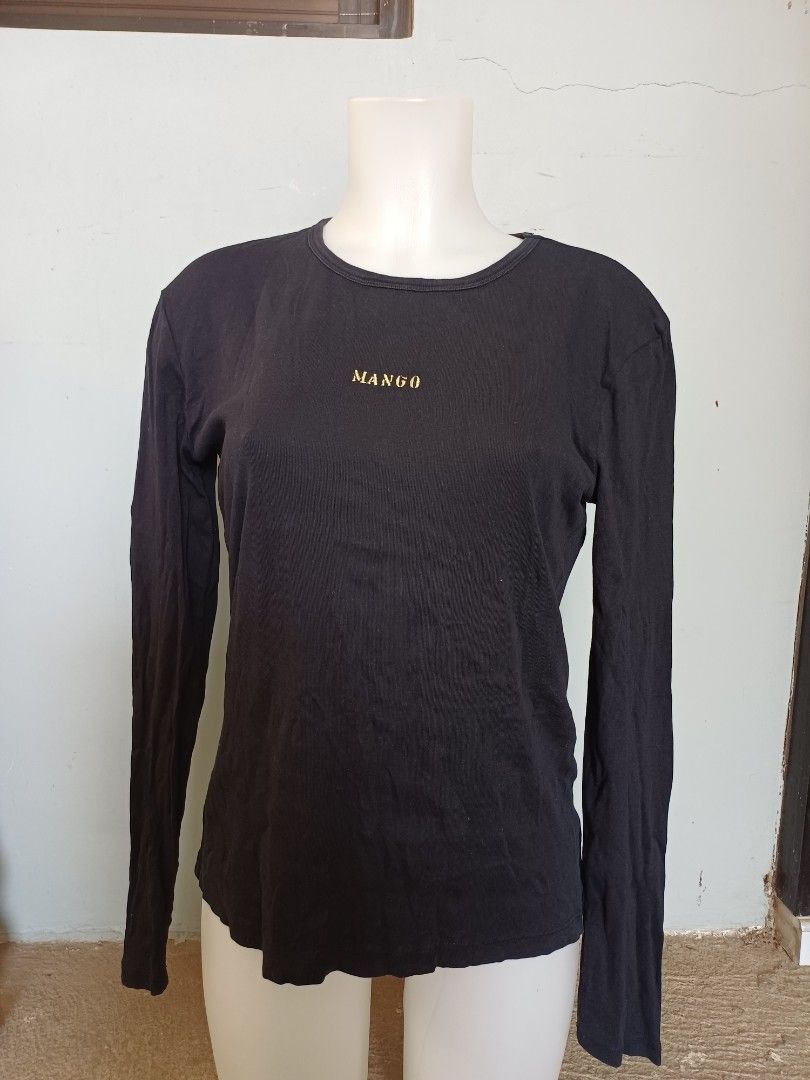 Mango Basics Long Sleeve Shirt - Black - XL (Category: Longsleeves) located in Calasiao. Submitted by mamadang (Listing ID 1433049827, Image 1). Description: - Mango Basics long sleeve shirt - Color: Black - Size: XL - Design: Round neck with gold Mango logo - Made in Vietnam.