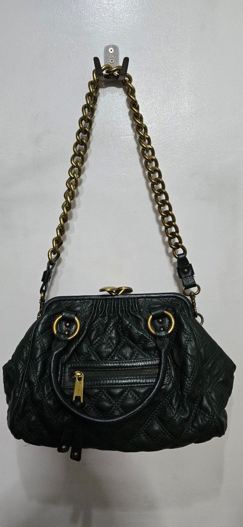 Marc Jacobs Vintage Quilted Leather Handbag (Category: Luxury Bags & Wallets) located in Manila. Submitted by baronessbest (Listing ID 1433050569, Image 1). Description: - Authentic Marc Jacobs handbag - Quilted design with chain strap - Elegant dark green exterior - Luxurious burgundy interior lining - Gold-tone hardware - Secure clasp closure - Convenient zippered front pocket - Interior zippered pocket - Includes top handle.