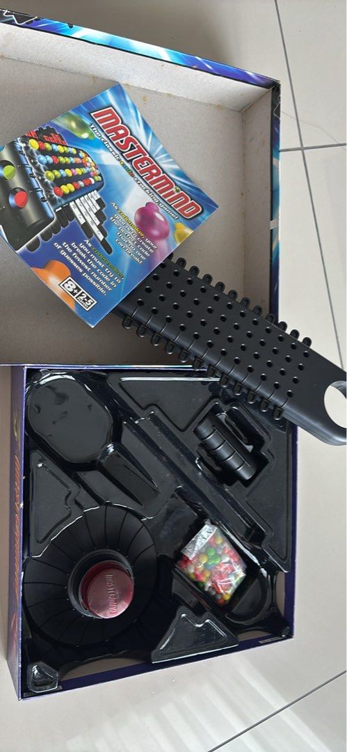 Mastermind Classic Code Cracking Game (Category: Toys & Games) located in Kuala Lumpur. Submitted by alexandra_11 (Listing ID 1433014264, Image 2). Description: - Classic Mastermind game - Includes game board, pegs, and code pegs - For up to 5 players - Complete set - Recommended for ages 8+ - Fun for family and friends.