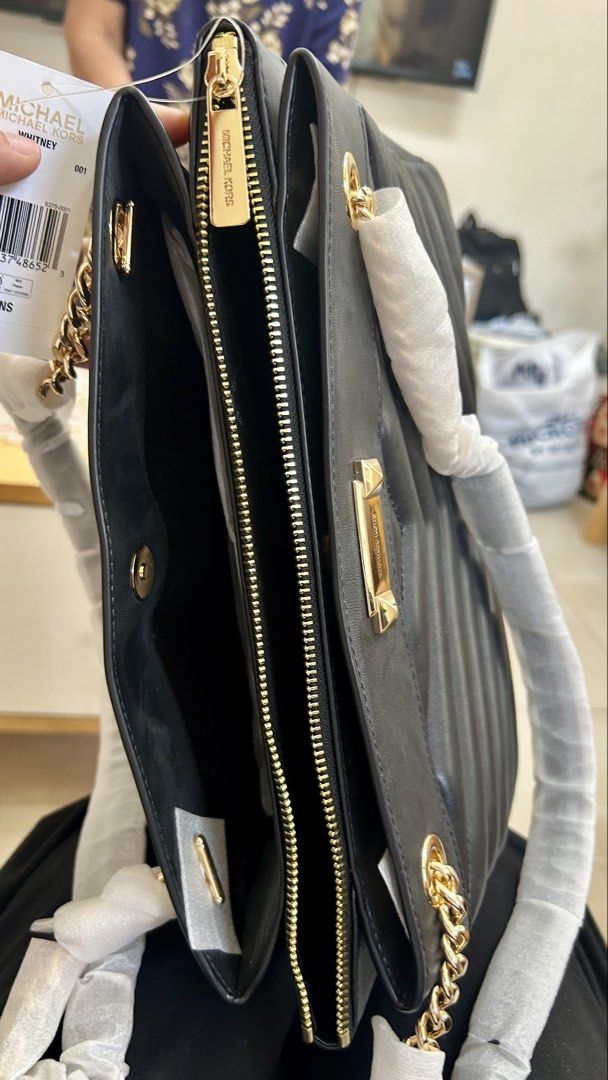 Michael Kors Whitney Black Handbag (Category: Luxury Bags & Wallets) located in Cavite. Submitted by xaleene (Listing ID 1433039378, Image 3). Description: - Authentic Michael Kors Whitney handbag - Black quilted design - Gold-tone hardware - Chain strap - Multiple compartments - Zip closure - Michael Kors logo - Includes original tags - Perfect for everyday or special occasions - Negotiable for sure buyer .