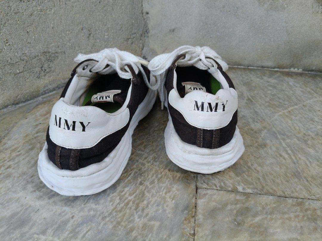 MMY Sneakers Maison Mihara Yasuhiro (Category: Sneakers) located in Tagbilaran City. Submitted by johnmcee (Listing ID 1433100733, Image 3). Description: MMY sneakers in black and white. US10. best fit 9.5. Features a unique design with a white toe cap and sole. The inner sole is green. The brand name is visible on the back of the shoes. The soles have a textured pattern for grip. issue: Replaced insole..