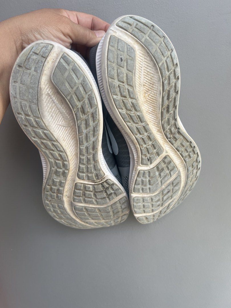Nike Downshifter 11 Gray Running Shoes (Category: Sneakers) located in Cavite. Submitted by jyesebel (Listing ID 1433017651, Image 3). Description: - Nike Downshifter 11 running shoes - US Size 9 - Color: Gray upper with white accents - Visible wear on soles and uppers - Model Number: CW3413-001 - Made in Vietnam Price: ₱1,000 (negotiable) plus shipping location: near Unitop Dasmariñas Cavite Wala pong sira madumi lang need labhan.