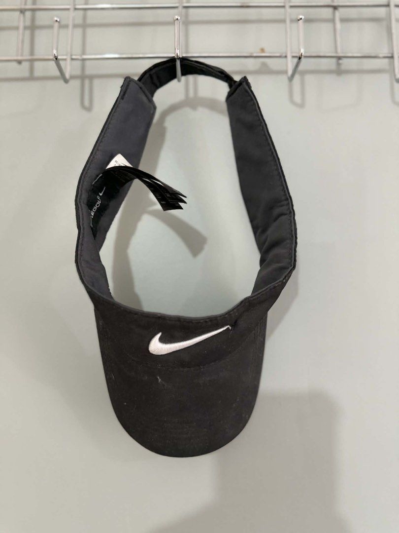 Nike Golf Visor (Category: Caps & Hats) located in Manila. Submitted by thasiasantos (Listing ID 1433136708, Image 1). Description: - Black Nike Golf visor - Features Nike logo - Adjustable strap for a custom fit - One size fits most - Made with polyester and cotton.