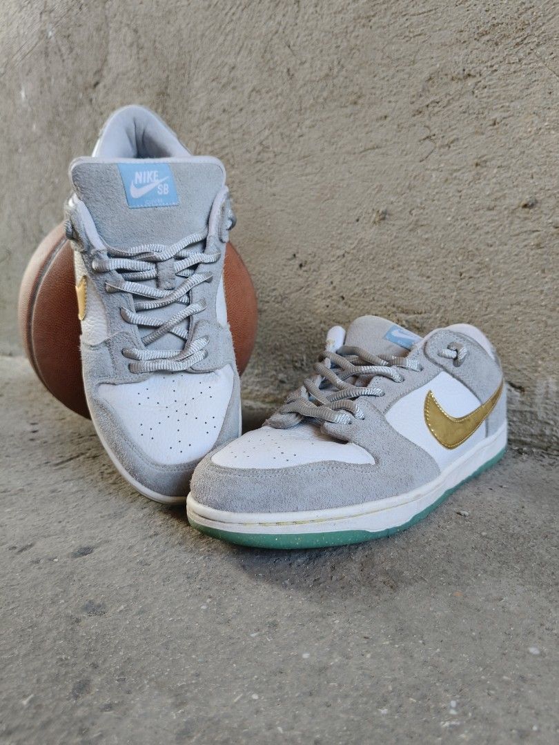 Nike SB Dunk Low Sean Cliver (Category: Sneakers) located in Tagbilaran City. Submitted by johnmcee (Listing ID 1433106634, Image 1). Description: Nike SB Dunk Low x Sean Cliver. UsS10 28cm - Color: Grey and white - Swoosh: Gold - Soles: Green - Laces: Grey - Tongue: Light blue - Condition: Good Shipping fee: 90.