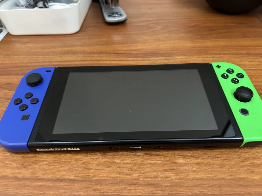 Nintendo Switch Console (Category: Nintendo) located in Muntinlupa City. Submitted by diamond_kd (Listing ID 1433015006, Image 3). Description: - Nintendo Switch console - Blue and green Joy-Cons - Dock with hdmi cable and original adapter - Joy-Con grip - Carrying case (Eevee design) - Two grips.