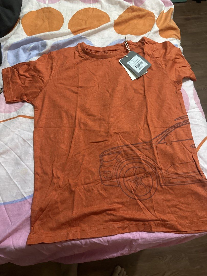 Orange Car Graphic T-shirt (Category: Tshirts & Polo Shirts ) located in Dasmarinas. Submitted by etcitems (Listing ID 1433129484, Image 1). Description: - Orange t-shirt - Features a car graphic - Crew neck - Short sleeves - Lightweight material - Brand new with tag - Solid orange color 140 size.