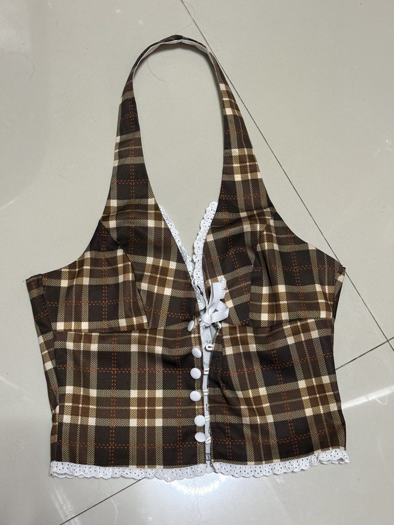 Plaid Halter Top with Lace Trim (Category: Sleeveless) located in Pasig City. Submitted by thaliak. (Listing ID 1433195734, Image 2). Description: - Brown plaid halter top - V-neckline with lace trim - Cute bow detail - Button-up front - Comfortable fit - Vintage-inspired.
