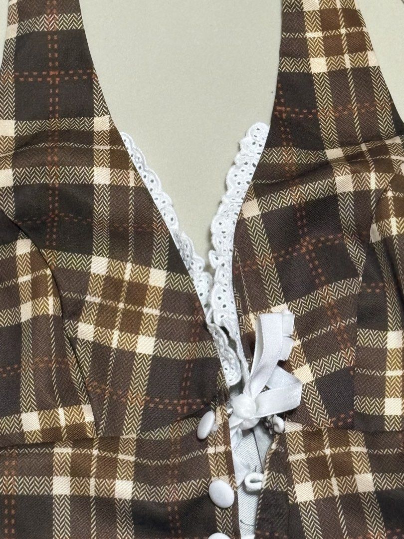 Plaid Halter Top with Lace Trim (Category: Sleeveless) located in Pasig City. Submitted by thaliak. (Listing ID 1433195734, Image 3). Description: - Brown plaid halter top - V-neckline with lace trim - Cute bow detail - Button-up front - Comfortable fit - Vintage-inspired.