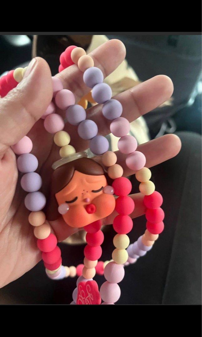 Pop Mart Crying for Love Necklace (Category: Necklaces) located in Pasig City. Submitted by jasalec (Listing ID 1433155942, Image 1). Description: - Pop Mart Crying for Love Necklace - New and unused - Features a colorful bead design - Includes a unique charm - Perfect accessory to add personality to your look.