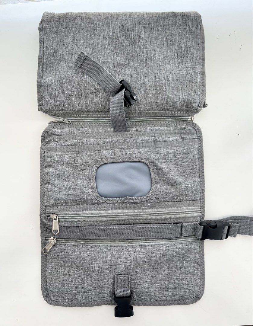 Portable Diaper Changing Pad (Category: Changing Mats & Accessories) located in Quezon City. Submitted by vinzvcc (Listing ID 1433062495, Image 2). Description: - Never been used - Portable diaper changing pad for convenient diaper changes anywhere. - Foldable design for easy storage and transport. - Features multiple compartments for essentials and detachable diaper pad - Includes a built-in wipe dispenser. - Secure buckle closure for safety. - 