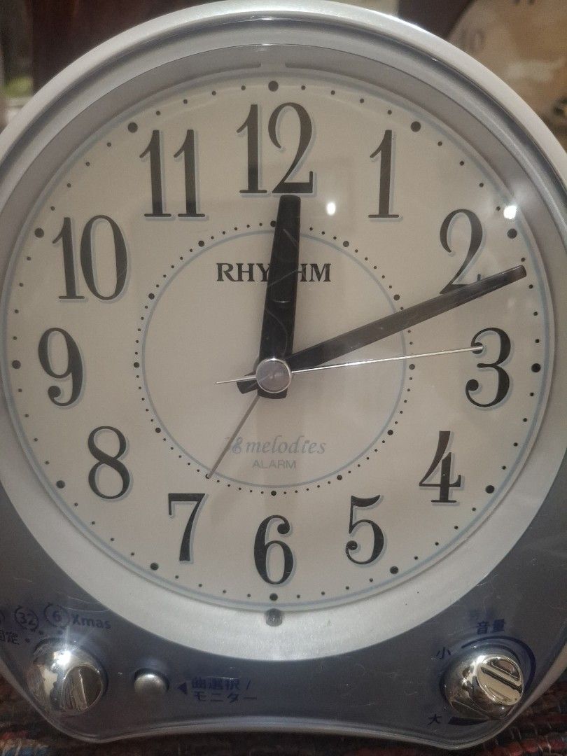 Rhythm Melodies Alarm Clock Japan (Category: Clocks) located in Manila. Submitted by youngcloud_b1fffa (Listing ID 1433177183, Image 3). Description: - Rhythm alarm clock - White face with black numerals and hands - Silver and blue casing - Two side knobs - Speaker on the back - Battery compartment - Displays time - Alarm function "R&B Mix Japan Surplus Items".