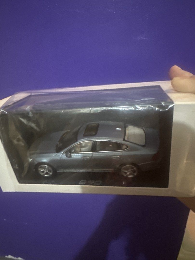 S90 Diecast Model Car (Category: Vehicle & Diecast Models) located in Dasmarinas. Submitted by etcitems (Listing ID 1433126704, Image 1). Description: - S90 diecast model car - Light blue color - Detailed wheels - Features a sunroof - Comes in a clear plastic case - Presented in a white box - Box includes the S90 model name.